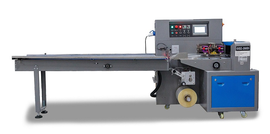 Горизонтальная упаковочная машина Hualian Machinery DXDZ-250XD с нижней подачей пленки (3 сервопривода. лент. 100 мм, рег.форм., мин. пакет Д-65 мм, В-40 мм, 2-х позиц.нож)